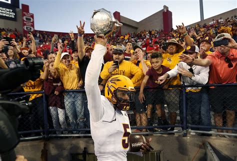 Ranking the Top College Football Rivalry Game Trophies.